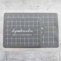 Two grey Silicone Baking Mats in different sizes shown side by side