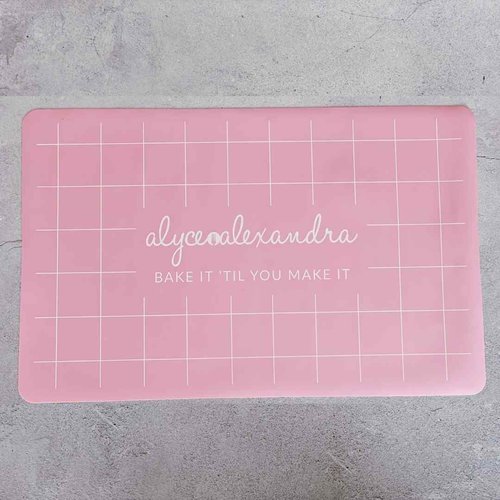 Large pink Silicone Baking Mat laid flat showing its full grid guide