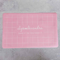 Large pink Silicone Baking Mat laid flat showing its full grid guide