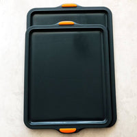 Two Silicone Baking Trays in different sizes stacked to compare them