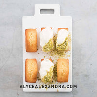 Four iced pistachio loaves in the grey Silicone Bar Moulds tray