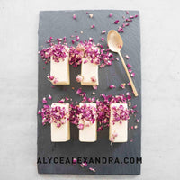 White chocolate bars scattered with dried rose petals on slate, made in the Silicone Bar Moulds