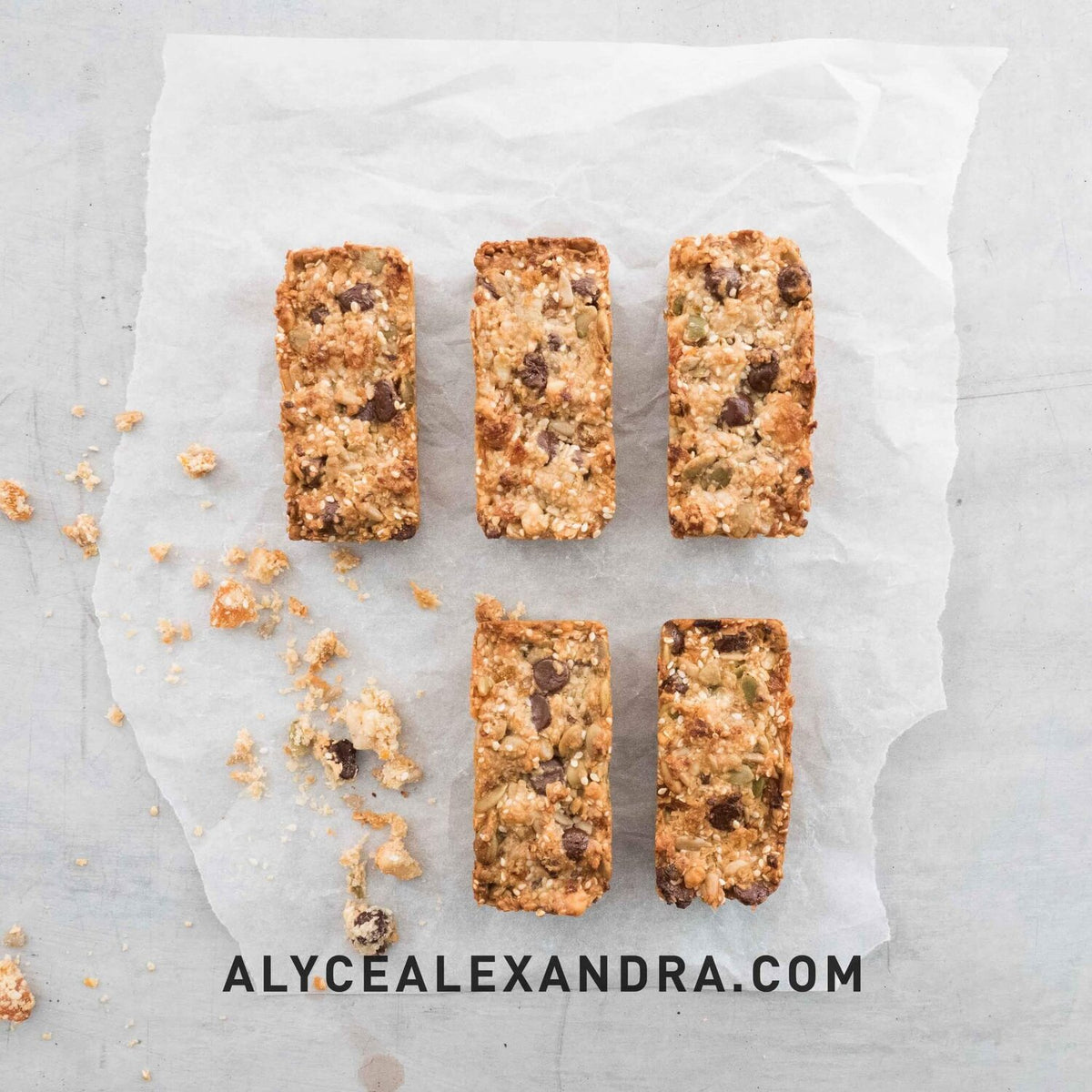 Seeded muesli bars on baking paper, made in the Silicone Bar Moulds