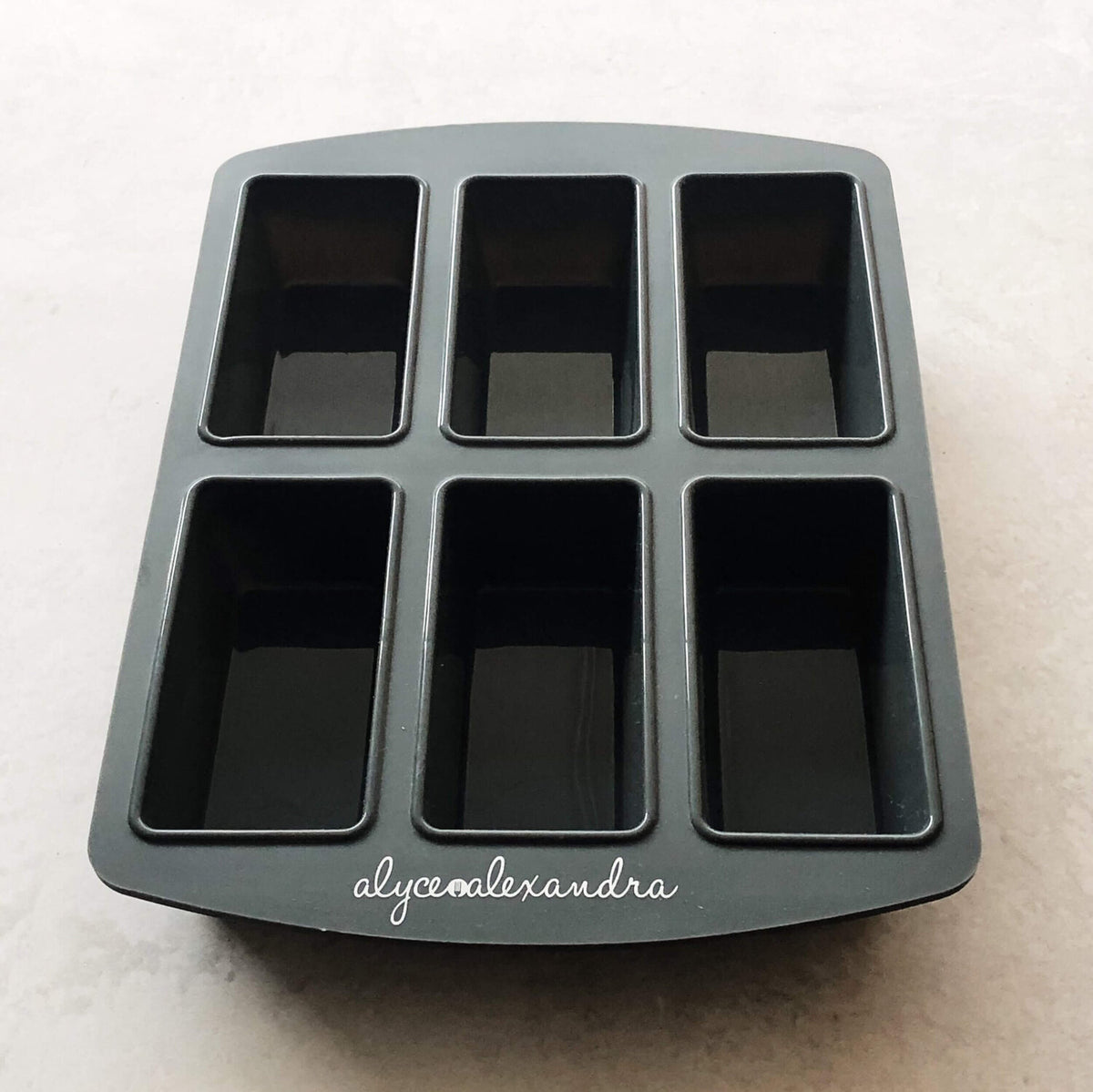 Grey Silicone Bar Moulds tray with six deep rectangular cavities