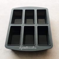 Grey Silicone Bar Moulds tray with six deep rectangular cavities