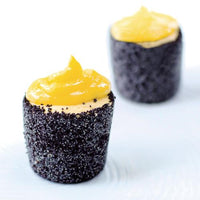 Two set desserts topped with passionfruit curd, made in the Silicone Dariole Moulds