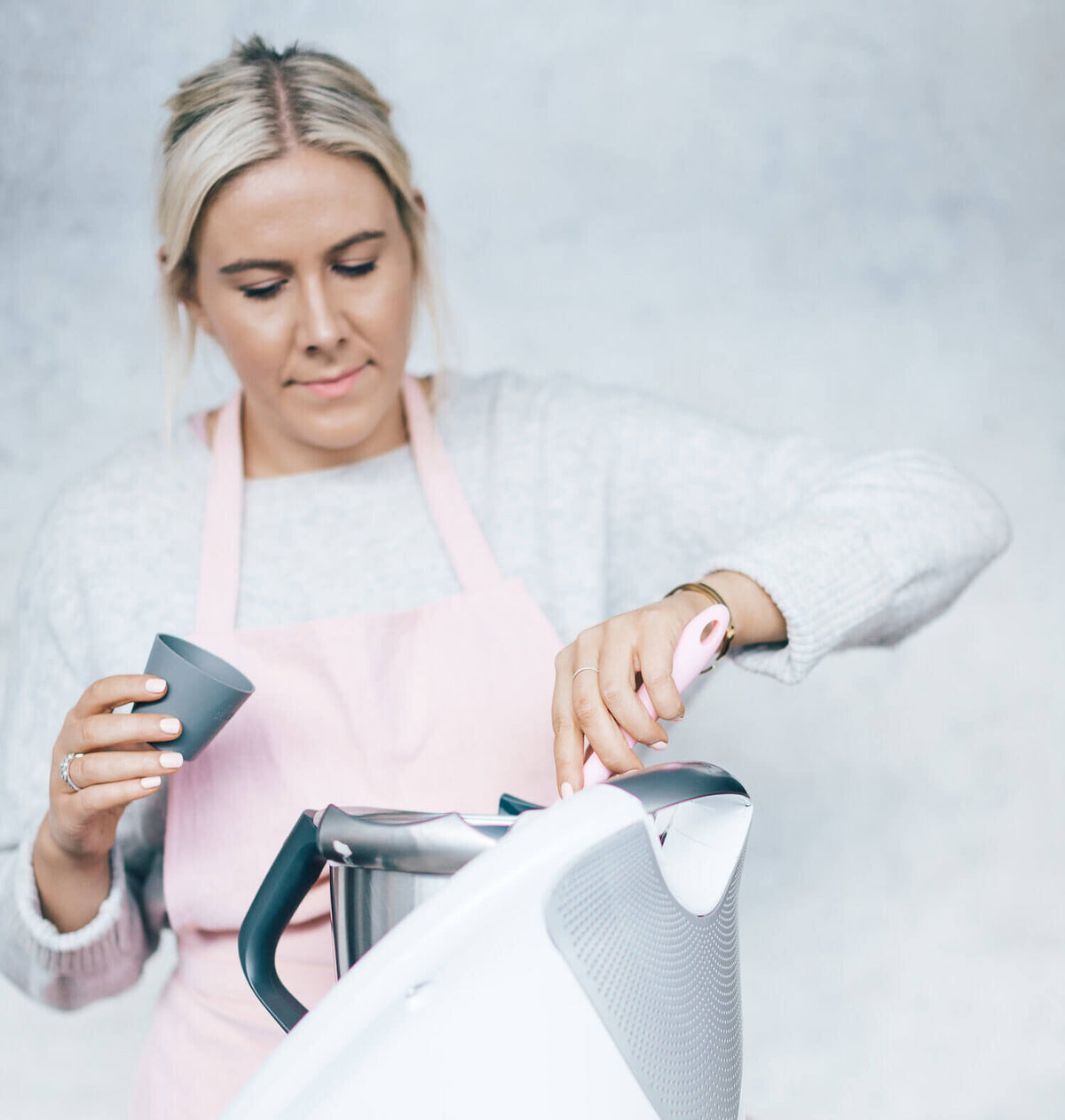 Alyce filling Silicone Dariole Moulds beside her Thermomix