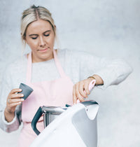 Alyce filling Silicone Dariole Moulds beside her Thermomix