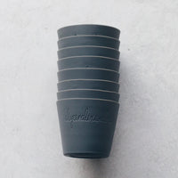 Stack of grey Silicone Dariole Moulds viewed from above