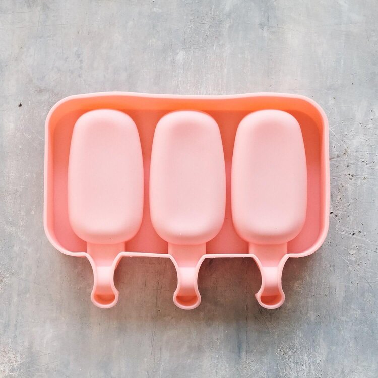 Silicone ice cream moulds in use