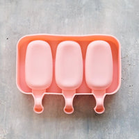 Silicone ice cream moulds in use