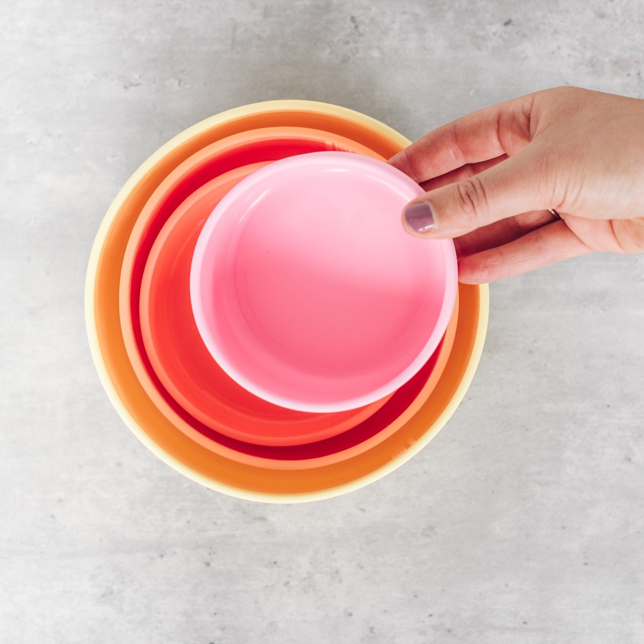 Silicone nesting bowls stacked together