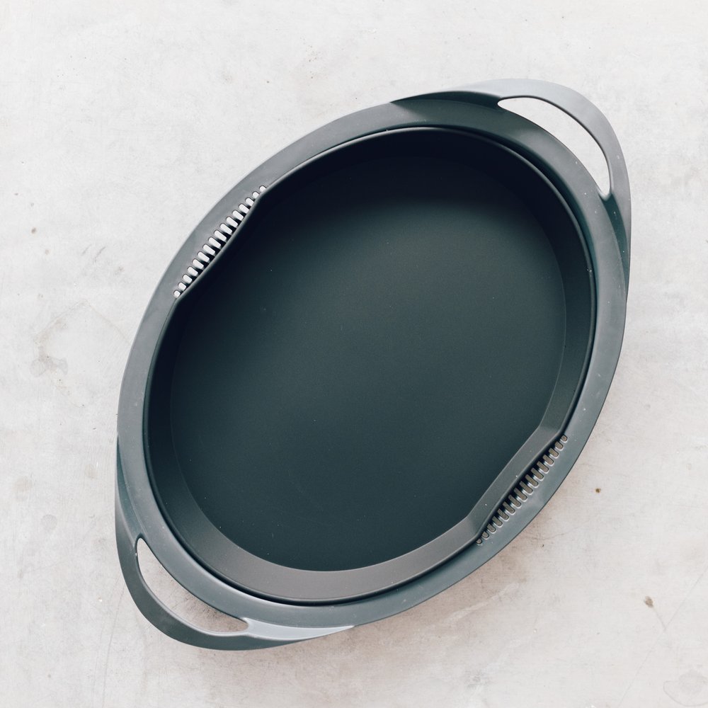 Silicone Steaming Mat for Varoma, a dark grey mat shaped to fit the Thermomix Varoma tray