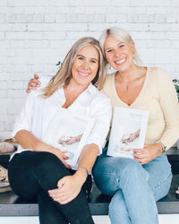 Alyce and Ellen sitting together holding copies of Simple Sourdough
