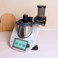Slicer and Shredder mounted on a Thermomix in a styled kitchen