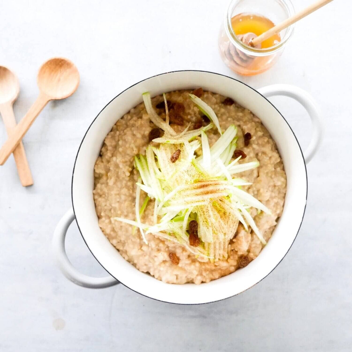 Pot of slow cooked risotto topped with cheese and herbs, from Slow Cooker Recipes with Thermomix-Prep Options