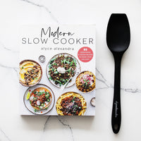 Modern Slow Cooker cookbook beside a charcoal Slow Cooker Spatula
