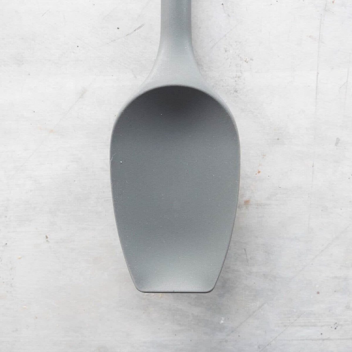Close-up of a Sourdough Spatula head from above, showing its broad scraping edge