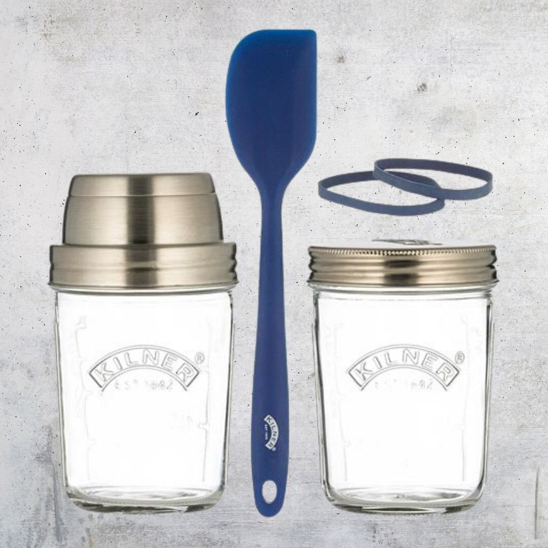 Contents of the Sourdough Starter Kit laid out: two Kilner jars, a blue silicone spatula and two rubber measuring bands
