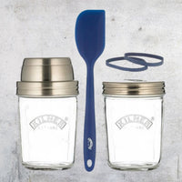 Contents of the Sourdough Starter Kit laid out: two Kilner jars, a blue silicone spatula and two rubber measuring bands