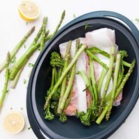 Flaked salmon steamed on the stainless steel trivet in the Thermomix Varoma