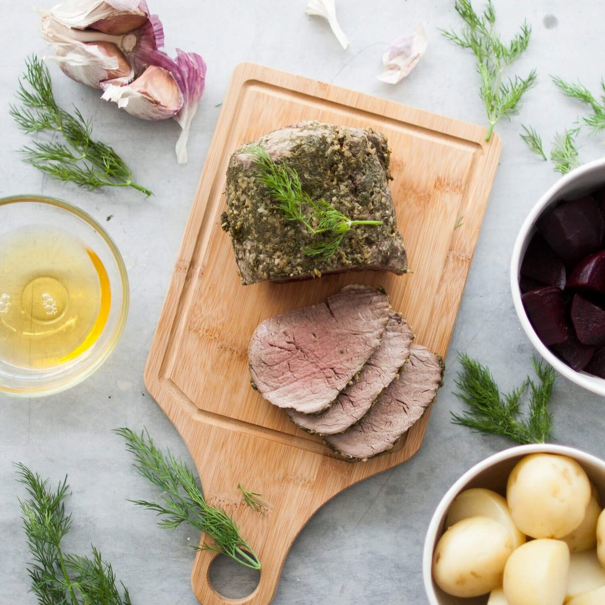 Roast beef resting on the stainless steel trivet in the slow cooker