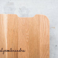 Close-up of the wooden slide board with the alyce alexandra name engraved on it