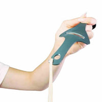 Hand holding the Tastix upright to show its slim tapered shape