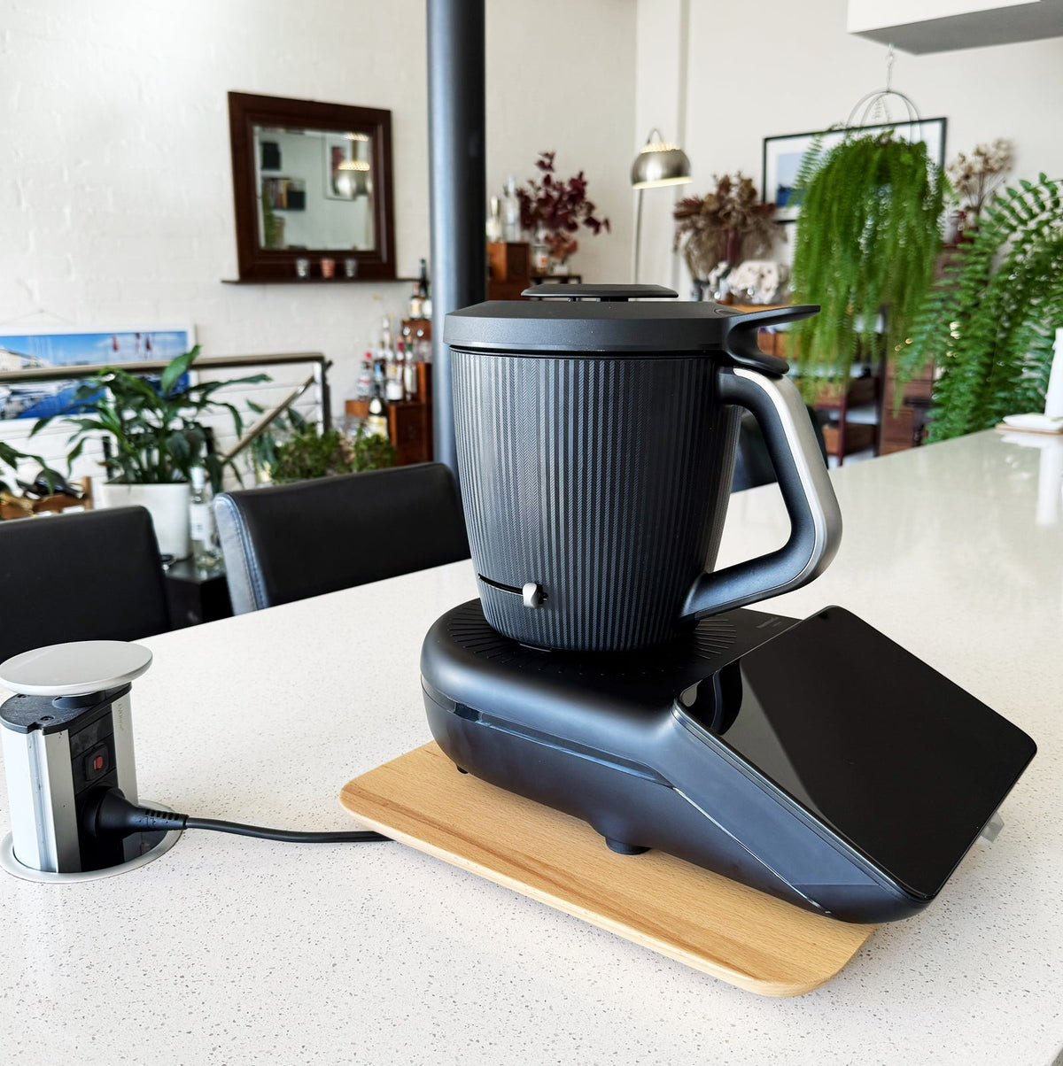 Dark Thermomix model sitting on the Thermo Deluxe Slide Board