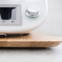 Close-up of the Thermomix base resting on the Thermo Deluxe Slide Board