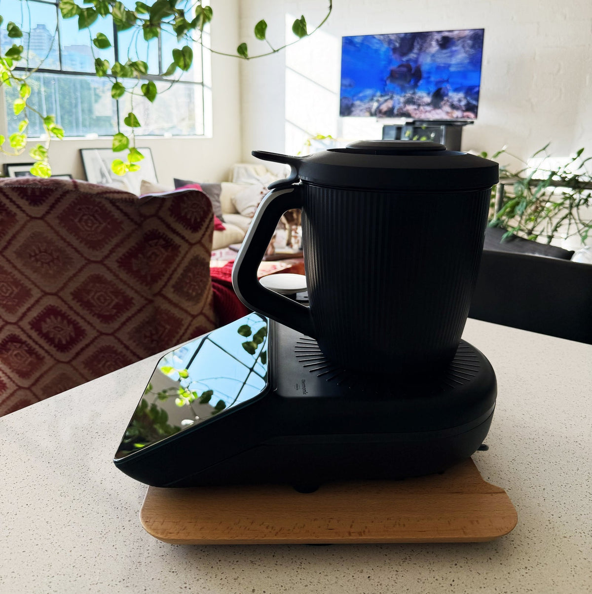 Dark Thermomix on the Thermo Deluxe Slide Board in a living space