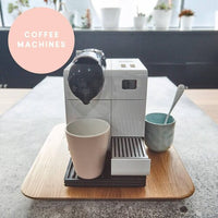 Coffee machine sitting on the Thermo Deluxe Slide Board, showing it fits other appliances