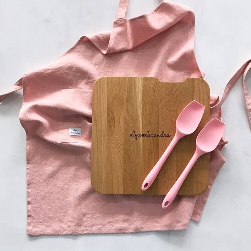 Thermo Deluxe Slide Board on a pink linen cloth with silicone spoons and flowers