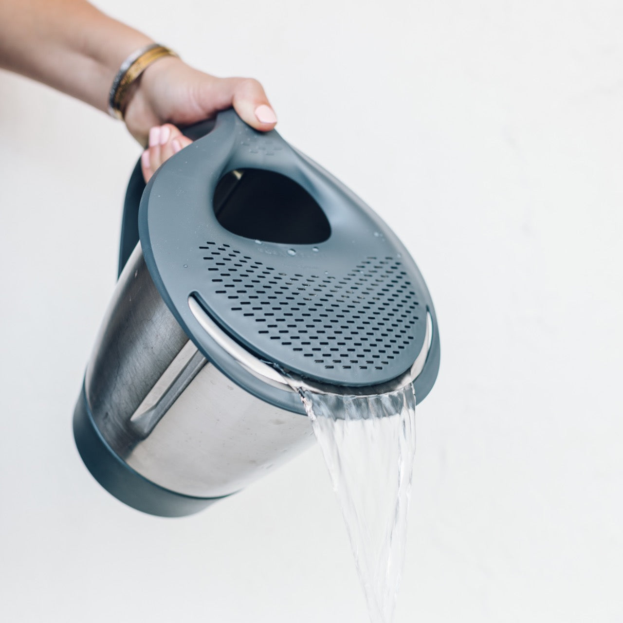 Thermo Lid Strainer fitted to a Thermomix mixing bowl, draining liquid out