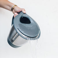 Thermo Lid Strainer draining water from a Thermomix bowl