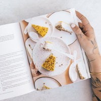 Hands holding a plate of vegan tart beside Thermo Plant-Based