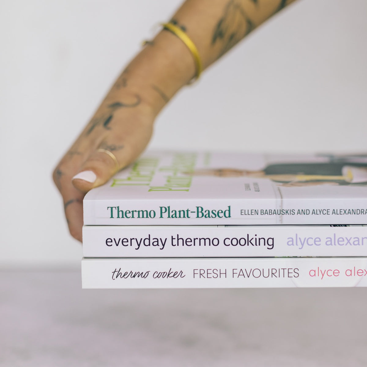Thermo Plant-Based shown in a stack with Everyday Thermo Cooking and Thermo Cooker Fresh Favourites