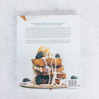 Thermo Plant-Based open at a recipe page beside a stack of pancakes with berries