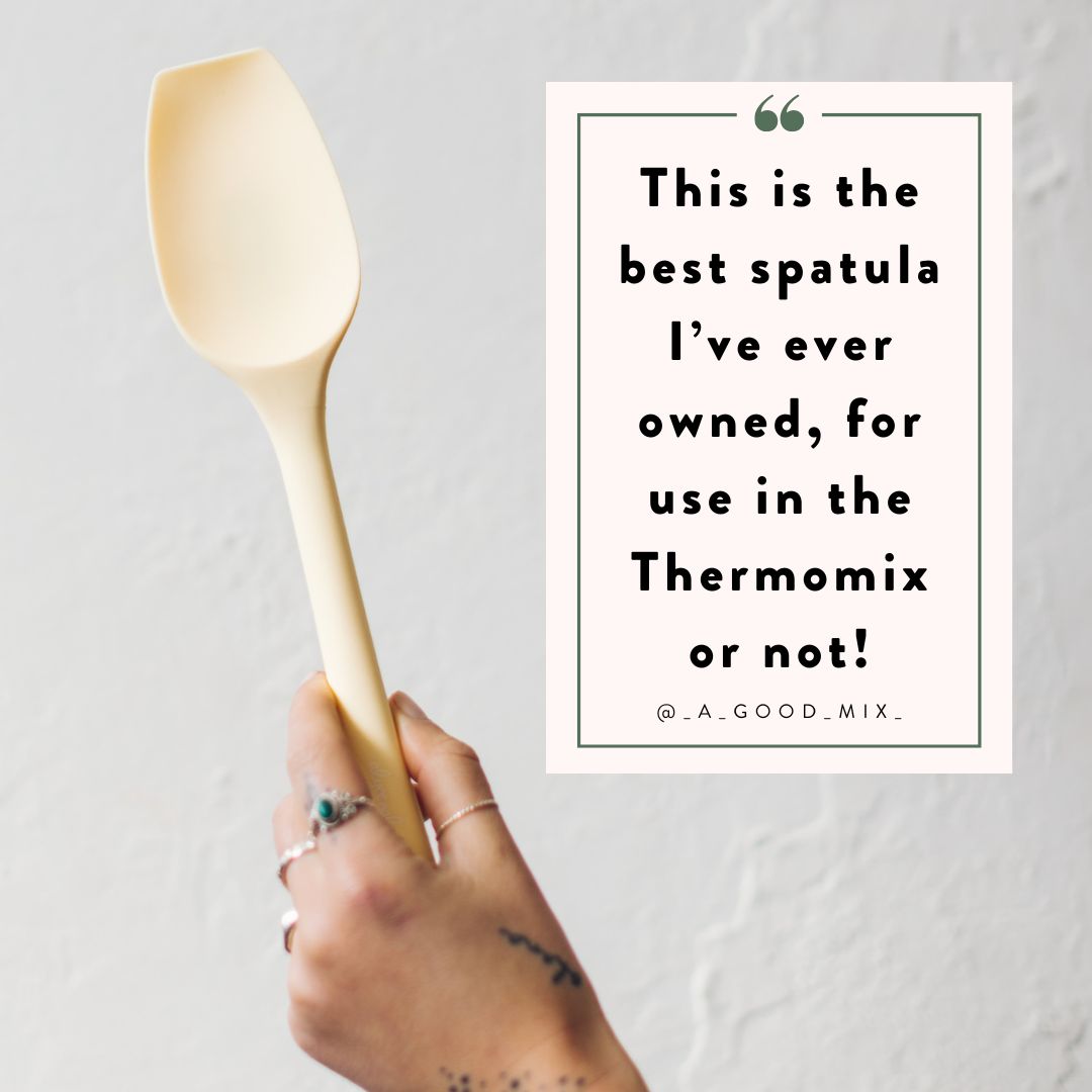 Spoon spatula scraping the bowl of a Thermomix clean