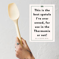 Spoon spatula scraping the bowl of a Thermomix clean