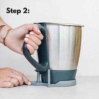 Step 2 of using the TM Twister: turn the handle to loosen the bowl base