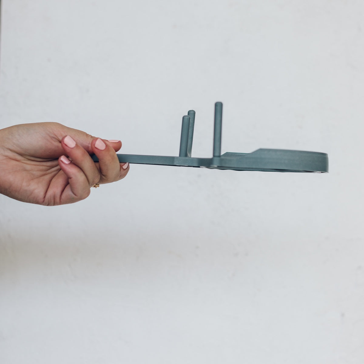 TM Twister held on its side to show its flat profile and lever