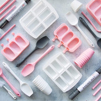Flat lay of the alyce alexandra silicone range including straws, moulds and spatulas