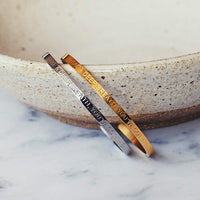 'You've Got This' cuff worn on the wrist