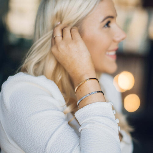 'You've Got This' cuff on a styled surface