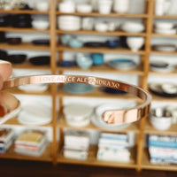 'You've Got This' cuff on the wrist