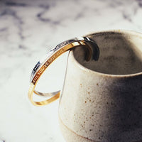 'You've Got This' cuff worn on the wrist