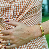 'You've Got This' cuff worn while cooking